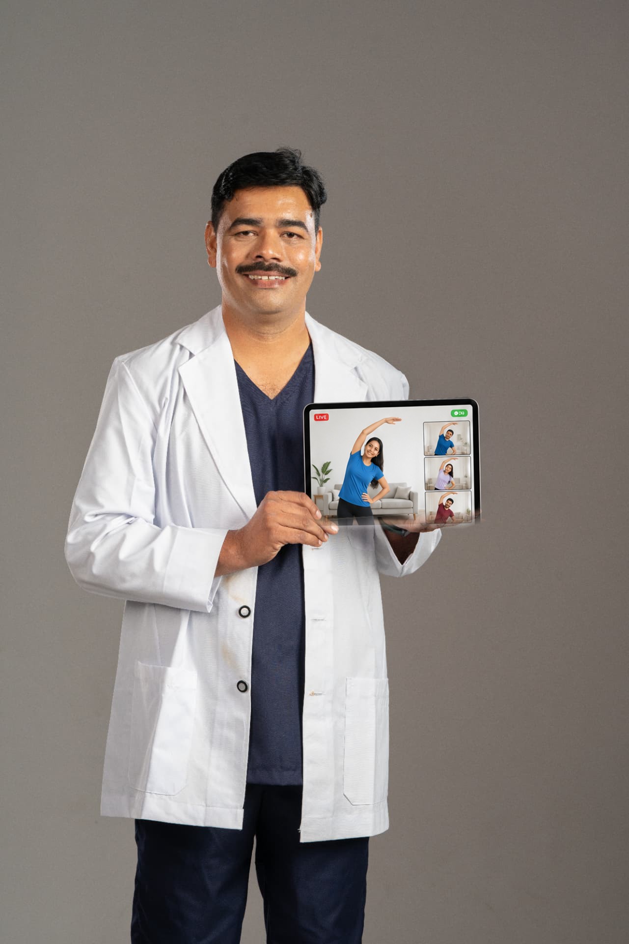 Dr. G. M. Patil presenting a live online movement session on his tablet